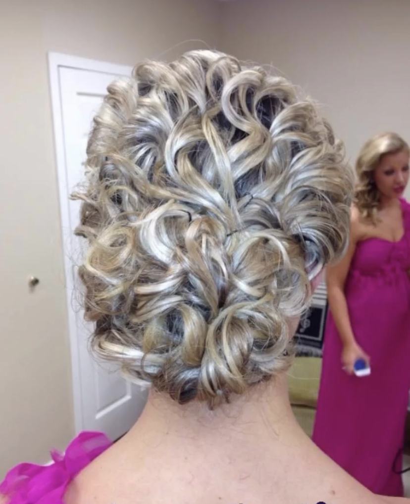 A blonde curled bridal updo