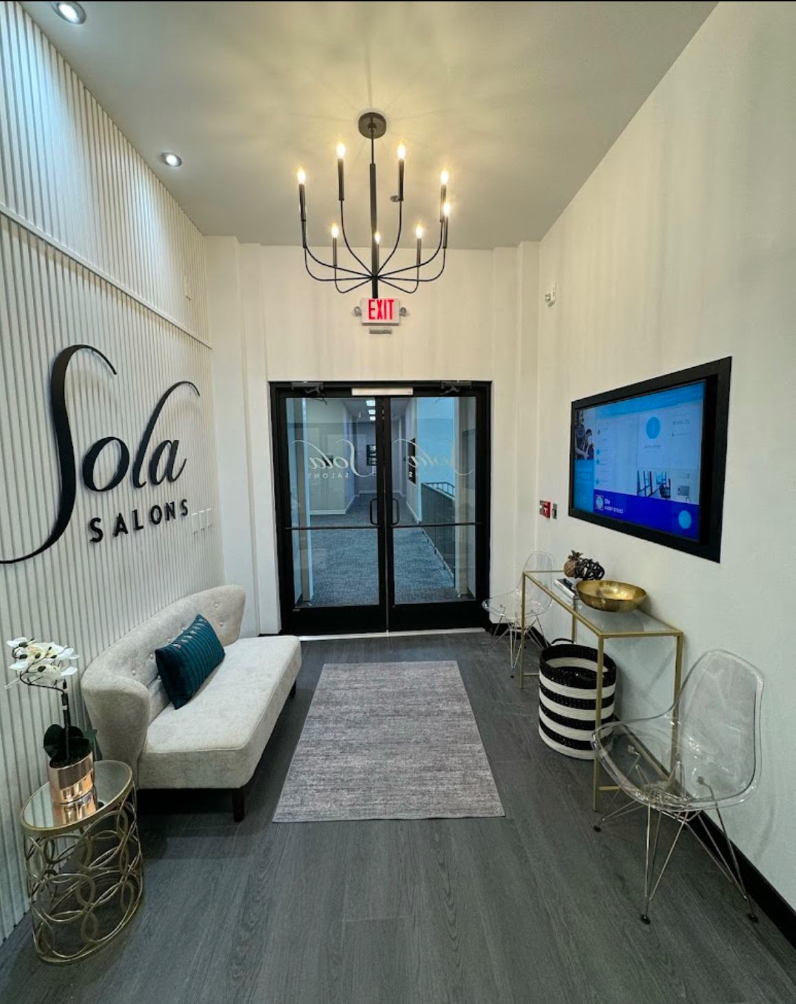 The Sola Salons lobby with a chandelier